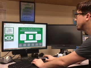 TNT staff on computer